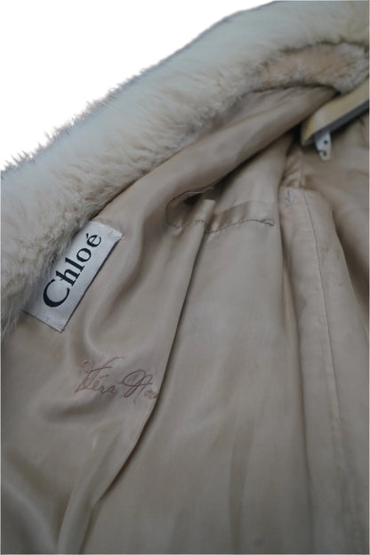  displayed on a branded Chloé hanger. The coat is facing forward