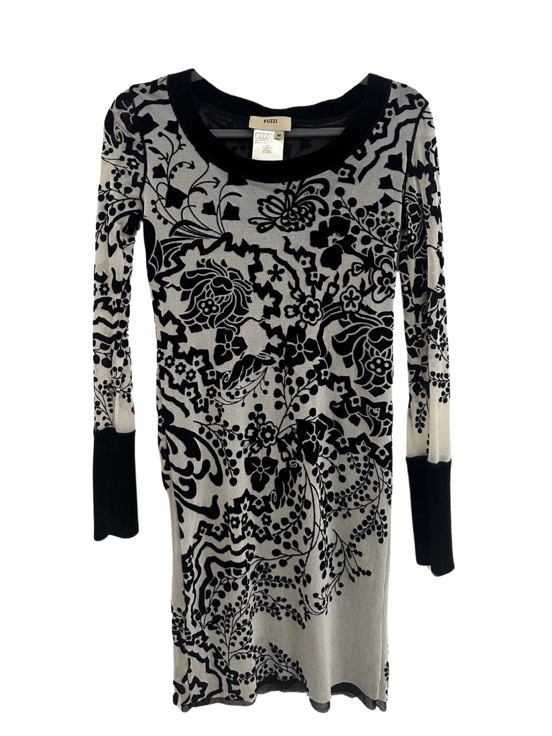 A Fuzzi mesh long-sleeve dress displayed facing forward on a hanger. The dress features an intricate black floral and paisley pattern against a sheer gray background