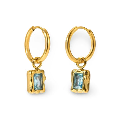  textured gold rectangular bezel setting holding a cubic zironia marquise-cut gemstone. 