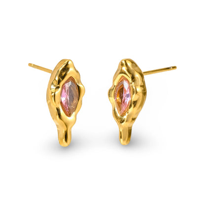 A pair of gold stud earrings with an organic