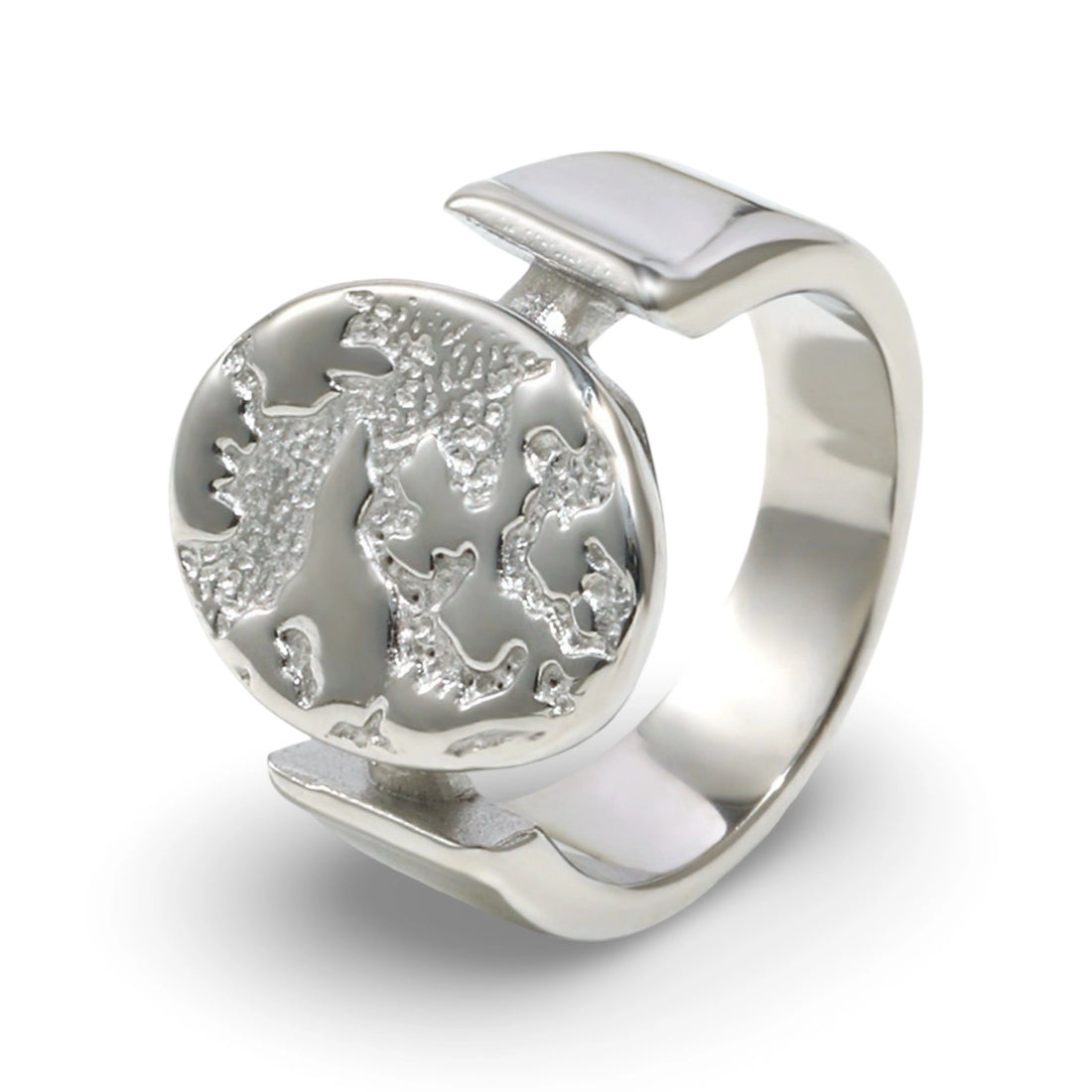 A textured oval ring featuring a raised relief design with an embossed tree motif.