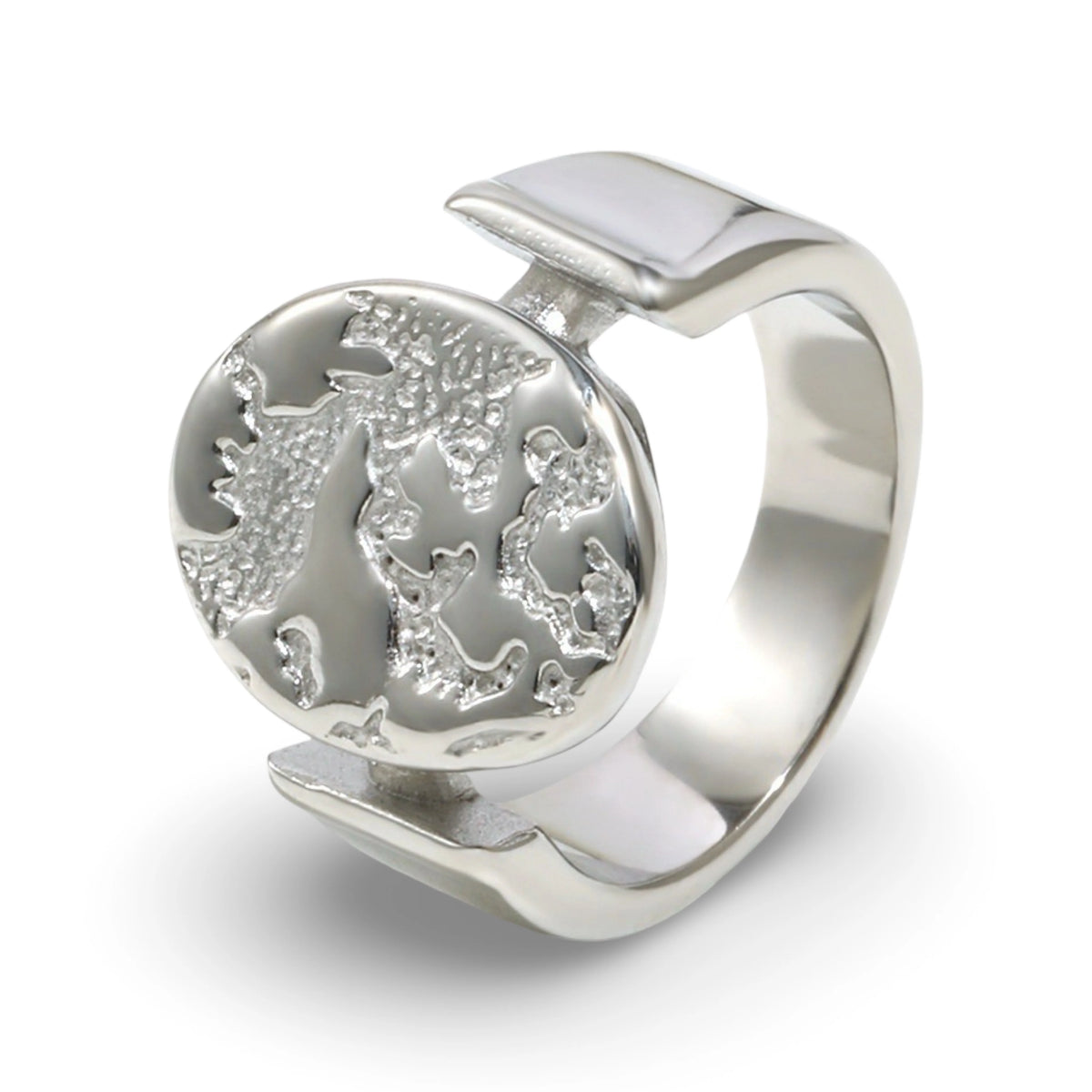 A textured oval ring featuring a raised relief design with an embossed tree motif.