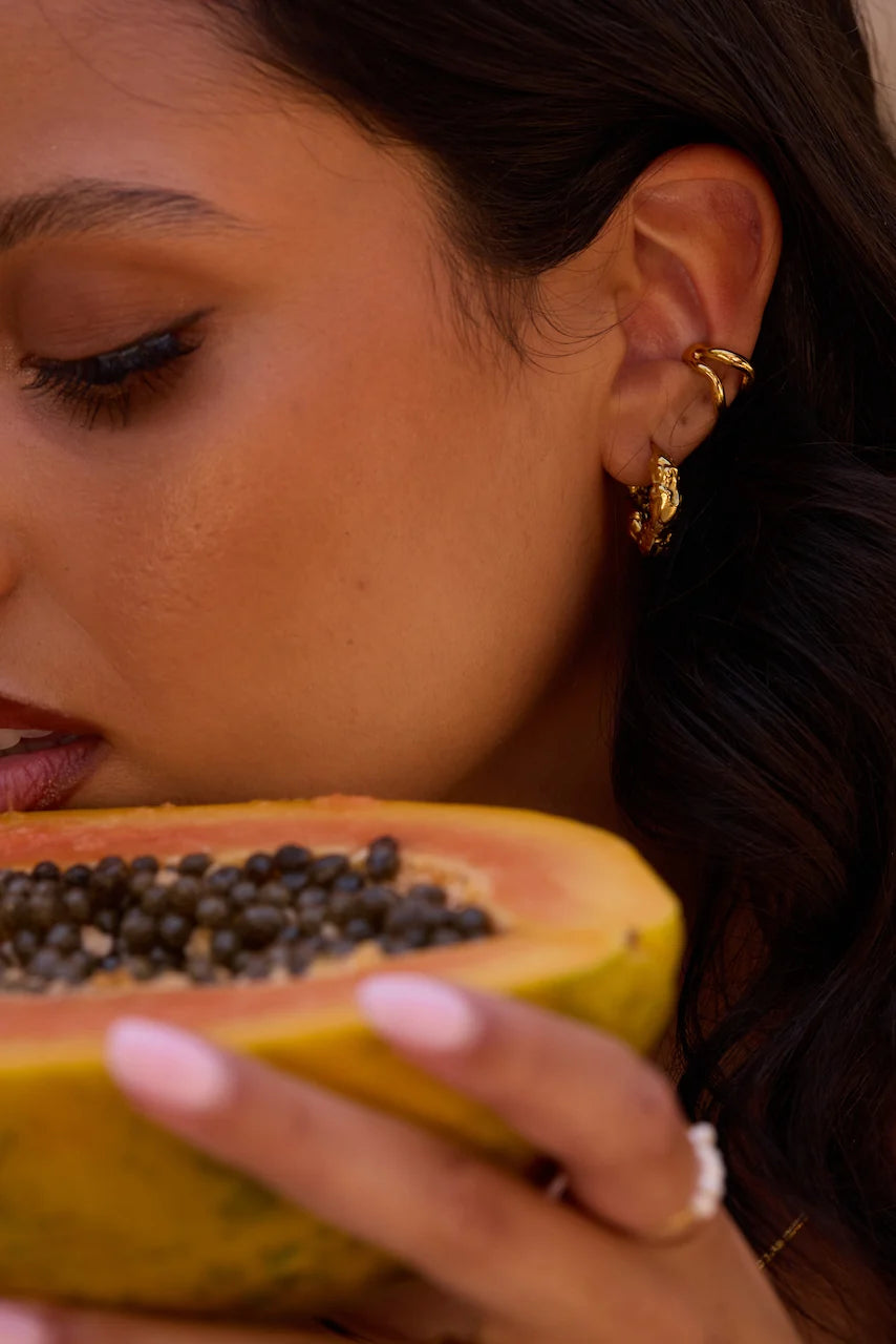 A pair of textured gold huggie hoop earringss 