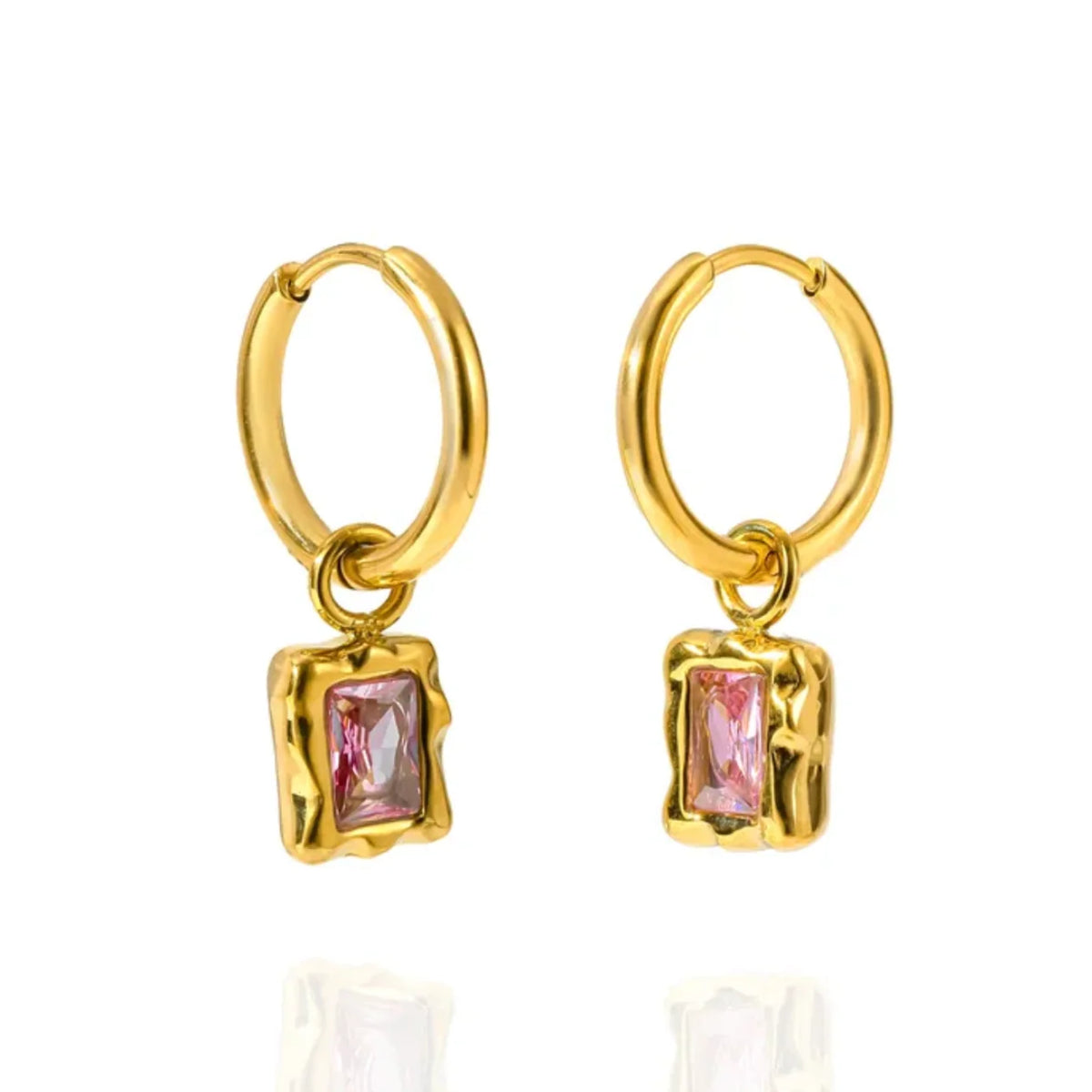 A pair of gold hoop earrings with a small