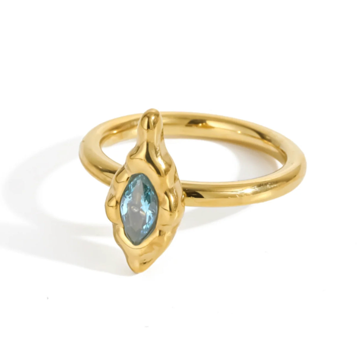 A gold textured ring featuring a marquise-cut CZ gemstone in a textured bezel setting.